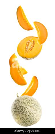 Flying ripe melons and slices isolated on white Stock Photo