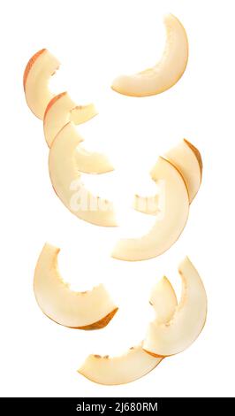 Falling slices of ripe melon isolated on white Stock Photo