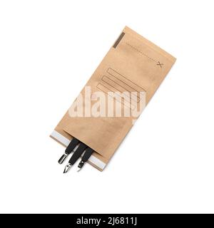 Paper bag with clean manicure tools isolated on white background Stock Photo