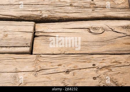 Surface of brown wooden planks with cracks Stock Photo