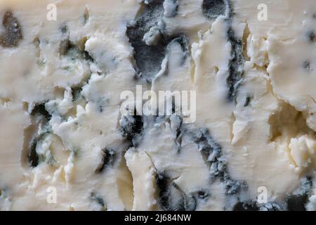 Blue cheese background and texture in the cut, top view, close up, macro Stock Photo
