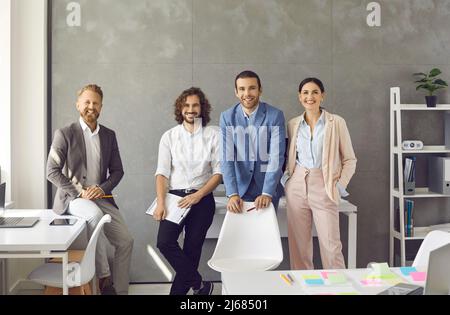 Portrait of smiling diverse businesspeople pose in office Stock Photo
