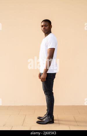 Full length portrait of handsome young African man Stock Photo