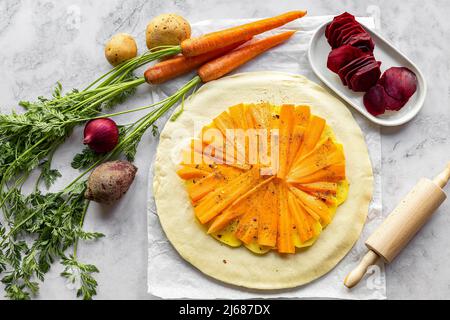 Step by step recipe of savory root vegetable galette. Step 2. Stock Photo