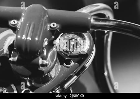 Analog speedometer of vintage scooter, close up monochrome photo with soft selective focus Stock Photo