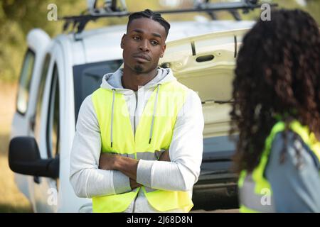 female motorist involved in car accident calling insurance company Stock Photo