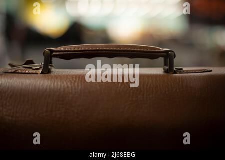 Leather bag. Men's briefcase made of brown leather. Accessory for guy. Business suitcase. Stock Photo