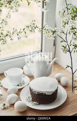 Spring Easter card. Easter cake and eggs. Flowering branches. Celebration and holidays. Stock Photo