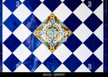 Traditional decorative tile with motifs from Castilla-La Mancha and Don Quixote, in Spain, in the city of Lietor. Made in Manises. Stock Photo
