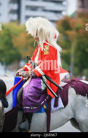 Uurga Horseman dressed in traditional costume hold rope and pole urga or ...
