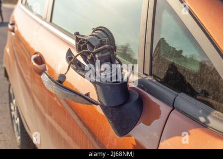 Broken side mirror on dirty car closeup. Damaged right door mirror close up Stock Photo