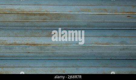 Horizontal view blue corrugated metal sheet texture. Weathered rusty metal texture background. Stock Photo