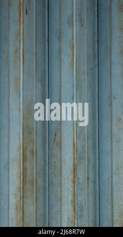 Vertical view blue corrugated metal sheet texture. Weathered rusty metal texture background. Stock Photo
