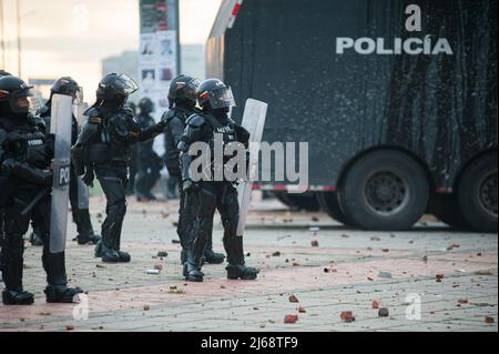 Colombia's riot police clash with demonstrators during the 28 of April commemorative demonstrations against the government of president Ivan Duque and