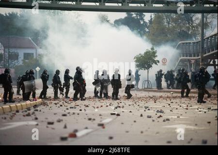 Colombia's riot police clash with demonstrators during the 28 of April commemorative demonstrations against the government of president Ivan Duque and Stock Photo