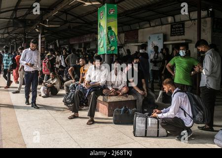 Dhaka, Bangladesh. 29th Apr, 2022. People wait on a platform to board a train at Dhaka Airport Railway Station. People returning home to celebrate Eid al-Fitr festival, which marks the end of Islam's Holy fasting month of Ramadan. Credit: SOPA Images Limited/Alamy Live News Stock Photo