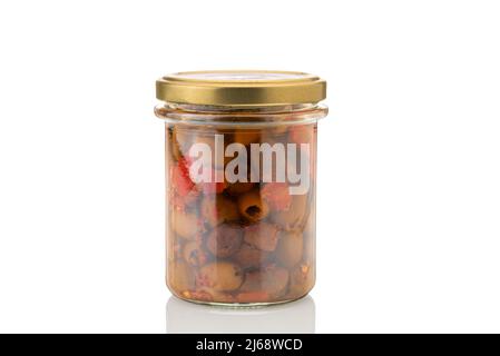 Pitted olives in glass jar, stoned olives in oil with peppers and chilli. Isolated on white, clipping path Stock Photo