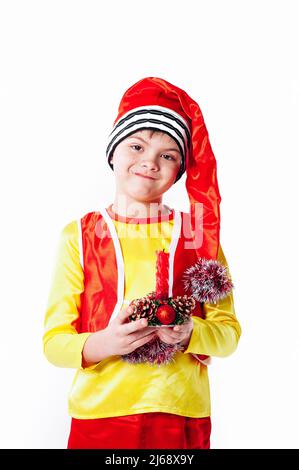 A baby dressed as a elf. isolated. Santa's helper. boy in suit of dwarf or elf Stock Photo