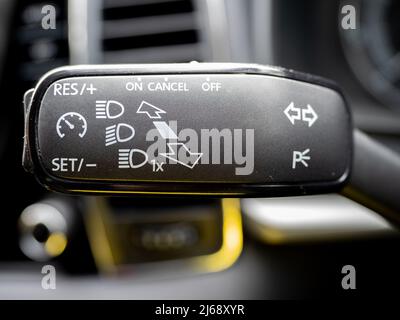 car steering light stalk with control buttons and switches for fog, main beam and dipped headlights Stock Photo