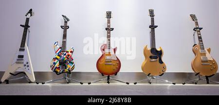 Bonhams, Knightsbridge, London, UK. 29 April 2022. Rock, Pop and Film Online sale includes the Gary Moore guitar Collection Part III, ending 4 May. Image (l to r): Gary Moore: Gibson Flying V Guitar, 2007, estimate £6,000-8,000; Jackson USA Strat Custom Guitar, 1988, estimate £2,500-3,000; Gibson Les Paul Standard 59 Reissue Guitar, Nicknamed 'Frankfurt', 2009, estimate £7,000-9,000; Gibson SG TV Guitar, 1961, estimate £5,000-6,000; Gibson Les Paul Standard Gold Top '57 VOS LPR-7 Guitar, 2007, estimate £6,000-8,000. Credit: Malcolm Park/Alamy Live News. Stock Photo