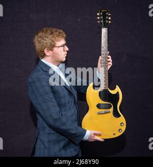 Bonhams, Knightsbridge, London, UK. 29 April 2022. Rock, Pop and Film Online sale includes the Gary Moore guitar Collection Part III, ending 4 May. Image: Gary Moore: Gibson SG TV Guitar, 1961, estimate £5,000-6,000. Credit: Malcolm Park/Alamy Live News. Stock Photo