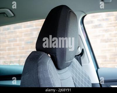 black fabric stitched cloth car headrest in upmarket sports utility vehicle Stock Photo