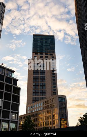 Waldorf Astoria high rise building in the capital of Germany. Luxury hotel skyscraper in front of a sunset sky. Architecture in Charlottenburg. Stock Photo