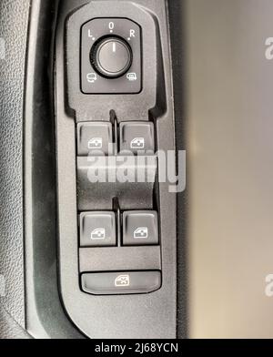 Car door cluster of dials and switches for windows  mirrors and central locking Stock Photo
