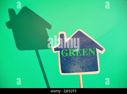 Blackboard in a shape of a house with the text 'Green' Stock Photo