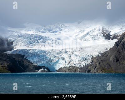 Ice and snow covered mountains with glaciers in King Haakon Bay, South Georgia, South Atlantic, Polar Regions Stock Photo