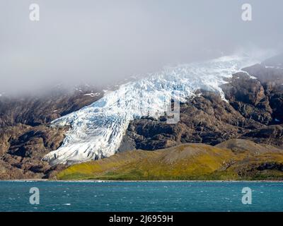 Ice and snow covered mountains with glaciers in King Haakon Bay, South Georgia, South Atlantic, Polar Regions Stock Photo