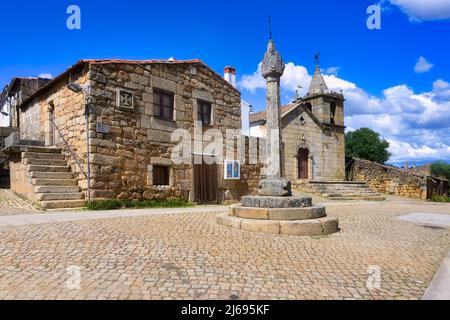 Stone pillory and Main Church, Idanha-a-Velha village, Serra da Estrela, Beira Alta, Portugal, Europe Stock Photo