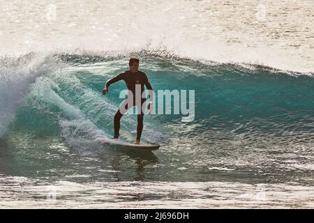 Surfing on Atlantic rollers at Ponta Preta, southwest coast of Sal, Cape Verde Islands, Atlantic, Africa Stock Photo