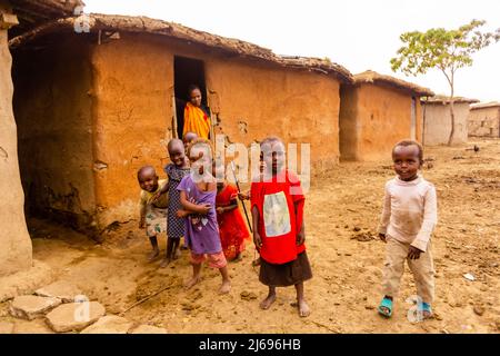 Local children in their home, Maasai Mara, Kenya, East Africa, Africa Stock Photo