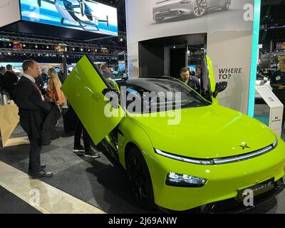 Stockholm, Sweden. 29th Apr, 2022. (220429) -- STOCKHOLM, April 29, 2022 (Xinhua) -- People look at an electric vehicle of XPeng during the Swedish eCarExpo 2022 in Stockholm, Sweden, April 29, 2022.  Swedish eCarExpo 2022 kicked off here Friday. More than 100 exhibitors showcase their latest products during the 3-day event. (Xinhua/Fu Yiming) Credit: Xinhua/Alamy Live News Stock Photo