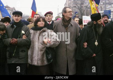 Bucharest, Romania, January 22, 1999. Political march organized by the Civic Alliance Foundation. Left to right: essayist Horia-Roman Patapievici, poet Ana Blandiana, & writer Romulus Rusan. Stock Photo