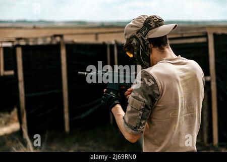 Soldier checking the weapon in the middle of a war Stock Photo