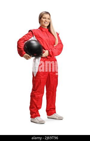 Female racer in a red suit posing and holding a helmet isolated on white background Stock Photo