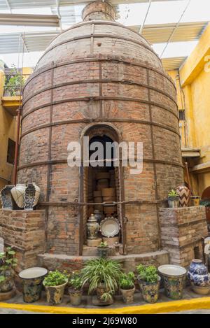 Ancient stone oven for cooking talavera pieces Stock Photo