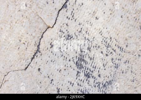 Cracked antique marble texture. Weather-cracked stone wall. Marble stone texture Stock Photo