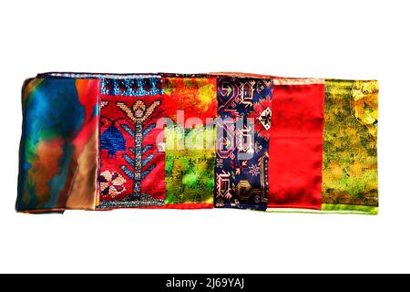 Turkish Oriental beautiful scarves with pictures of natural silk on a white background Stock Photo