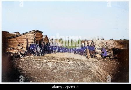 Winter Quarters of Unidentified Union Army Regiment with Two Rows of Log Cabins. 1861–65 Stock Photo