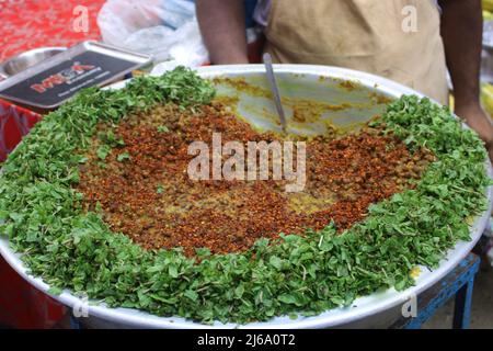 Dhaka, Bangladesh. 29th Apr, 2022. Chawk Bazar iftar market in Dhaka is well known for traditional spicy foods. Thousands of people gathered on a road in front of Chawk Bazar Shahi Mosque where sellers displayed plenty of traditional food items. (Photo by Tahsin Ahmed/Pacific Press) Credit: Pacific Press Media Production Corp./Alamy Live News Stock Photo