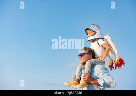 Senior man and child outdoor. Grandfather and boy having fun together. Family holiday concept. Happy Fathers day Stock Photo