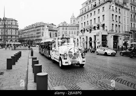 Tourist Train driving through the streets of Marseilles, France in Black and White