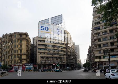 Urban landscape of the city center at the Tahrir Square (Liberation Square), also known as Martyr Square, a major public town square in downtown Cairo Stock Photo