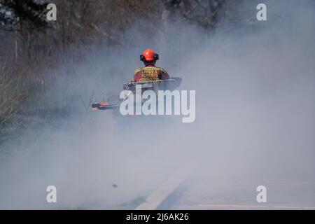 Ontario, Canada. 29th Apr, 2022. April 29, 2022, Toronto, Ontario, Canada: City of Toronto forest workers set light to a large portion of High Park in the west end of the city Friday afternoon. The controlled burn is meant to clear dried plants that are inhibiting new growth in the park. (Credit Image: © Arlyn McAdorey/ZUMA Press Wire) Credit: ZUMA Press, Inc./Alamy Live News Stock Photo