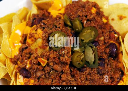 corn tortilla chips with spicy beef chili con carne Stock Photo