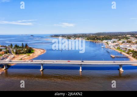 Car bridge across Clyde river in Batesman bay on AUstralian Sapphire coast - aerial landscape view. Stock Photo