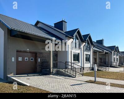 Exterior view of a modern townhouse. The concept of outdoor buildings of multi-apartment residential townhouses Stock Photo